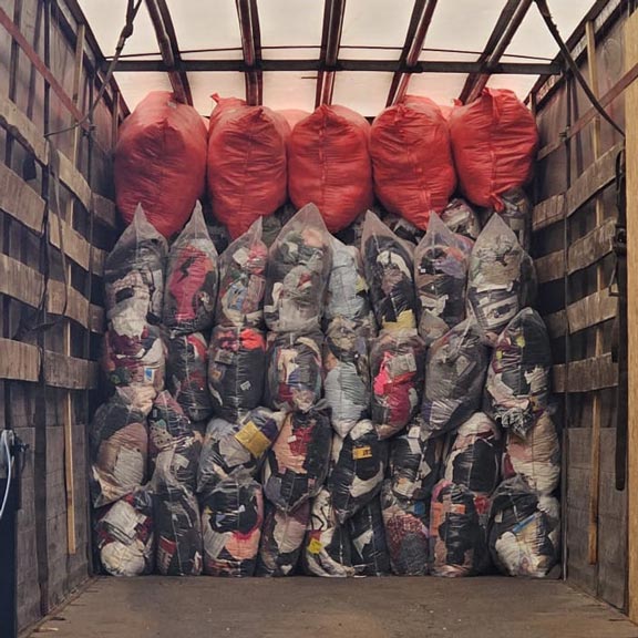 Seasonal used clothing mixes loaded in the truck